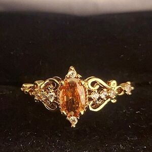Elegant Gold Ring with Orange Gemstone
